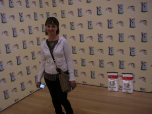 p6120010 Les and I visited the Art Institute museum when she was in town. Here she is with kitty litter and wallpaper!